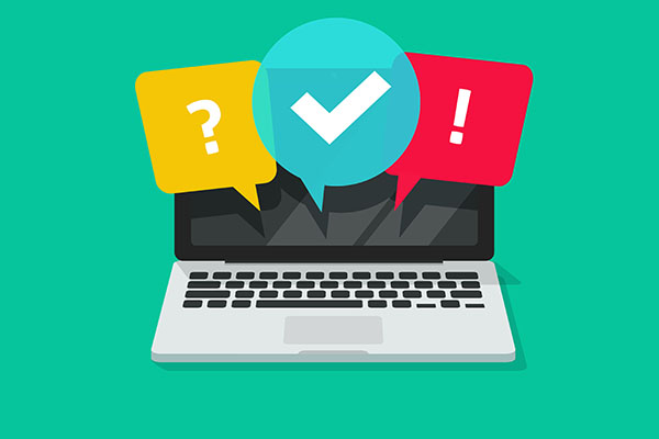 Laptop screen with colourful speech bubbles showing question mark, check mark, and exclamation mark, symbolizing online quizzes and instant feedback.