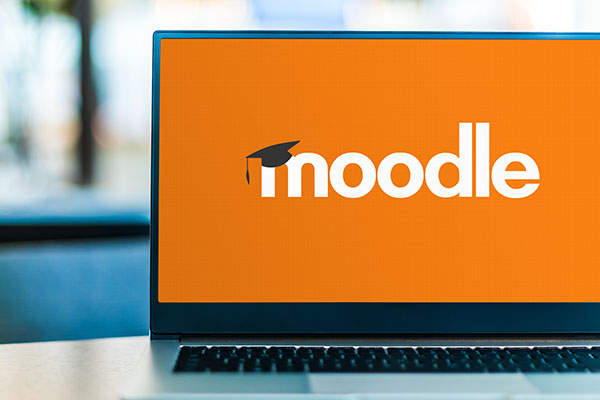 Laptop screen displaying the Moodle logo on an orange background