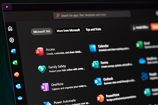Microsoft 365 application launcher displaying apps including Access, Family Safety, OneNote, Outlook, PowerPoint, Forms and Calendar on a dark-themed interface.